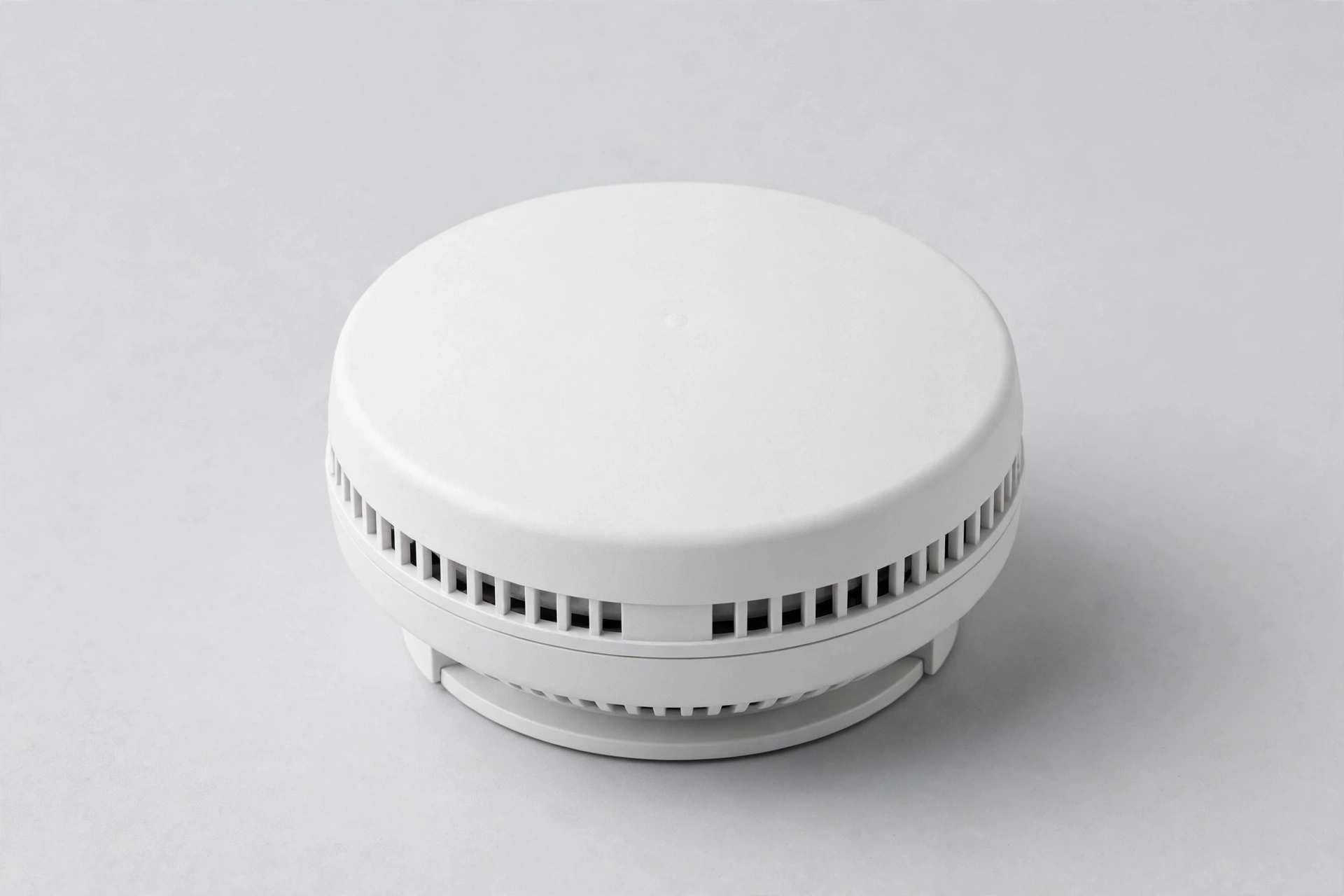 Round white hardwired smart smoke detector with side vents