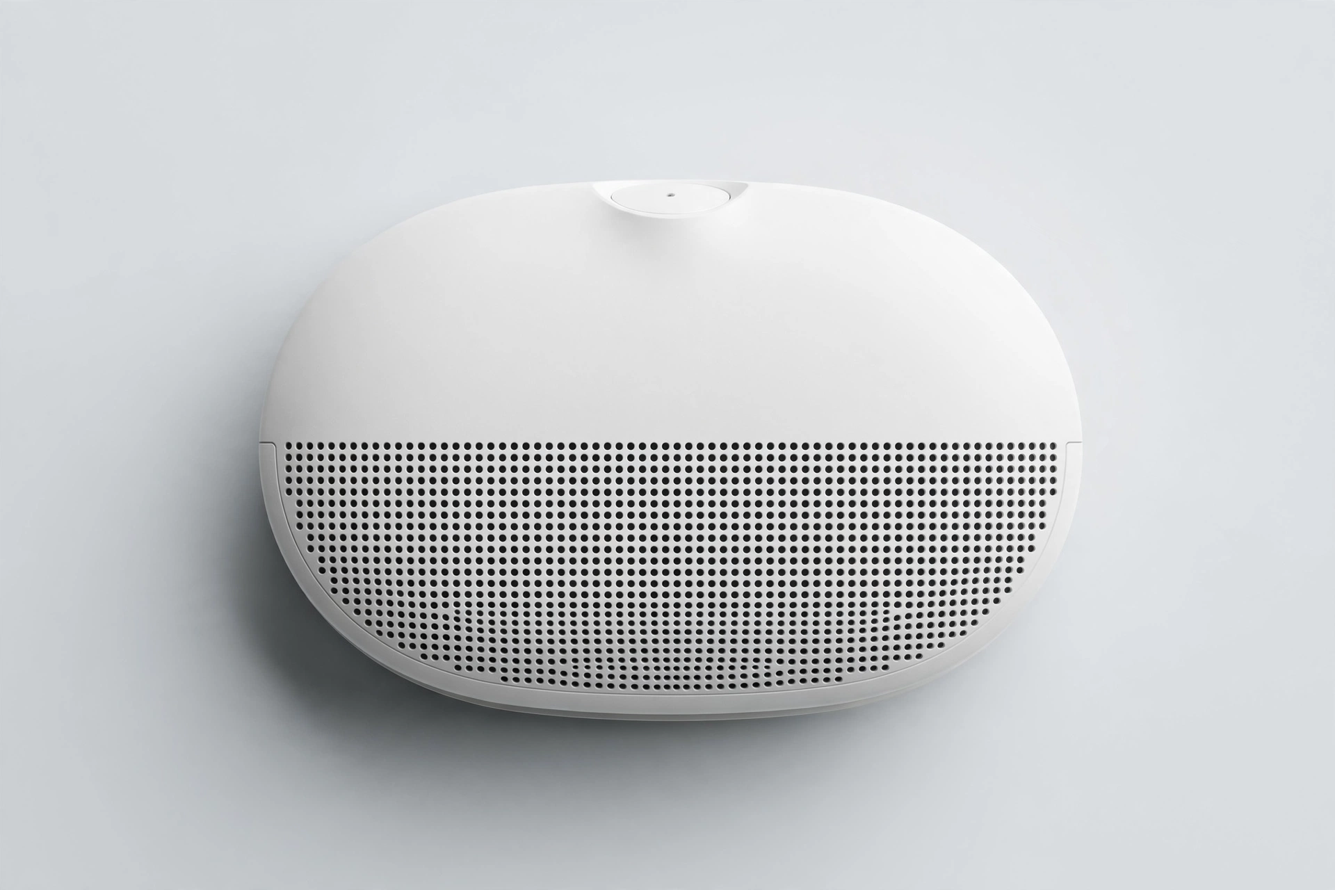Oval white smart smoke detector with speaker grille