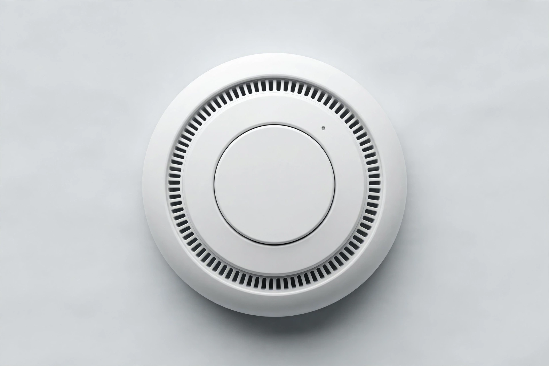 Round white Wi-Fi smoke detector with test button